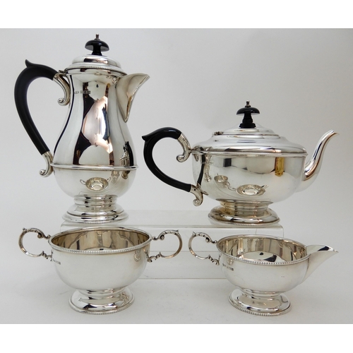 128 - A FOUR PIECE SILVER TEA SERVICE