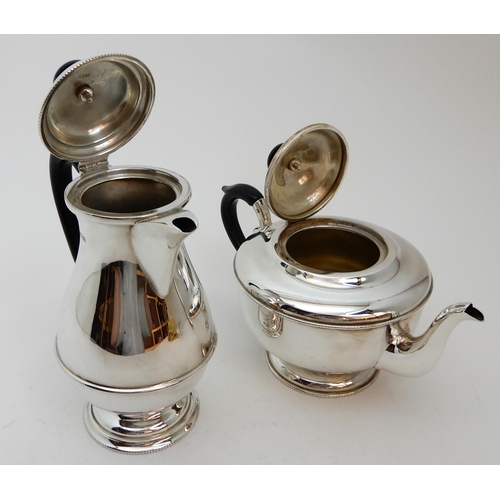 128 - A FOUR PIECE SILVER TEA SERVICE