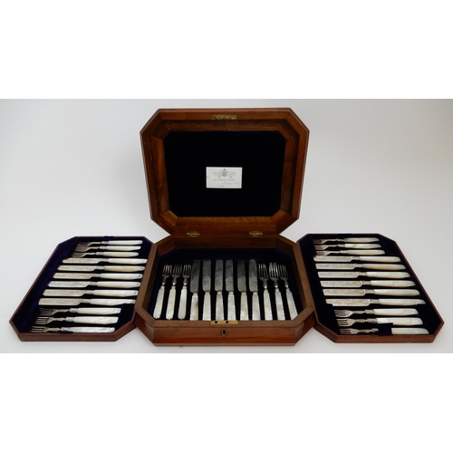 130 - A TWENTY FOUR PIECE SILVER AND MOTHER OF PEARL DESSERT CUTLERY SET