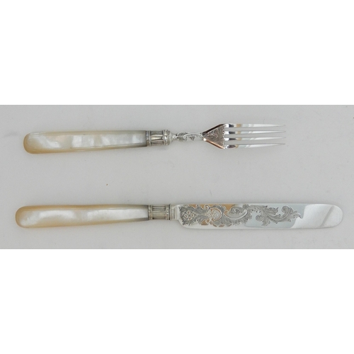 130 - A TWENTY FOUR PIECE SILVER AND MOTHER OF PEARL DESSERT CUTLERY SET