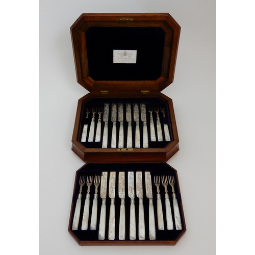 130 - A TWENTY FOUR PIECE SILVER AND MOTHER OF PEARL DESSERT CUTLERY SET