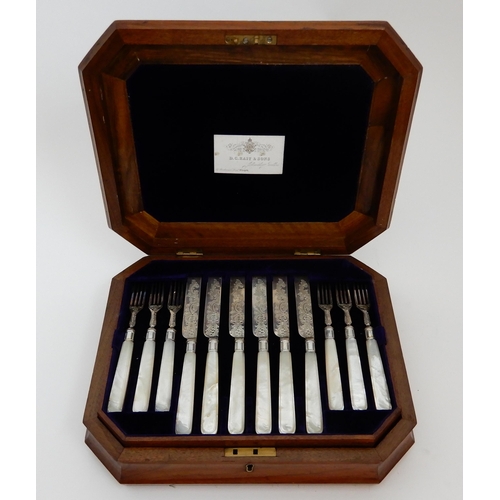 130 - A TWENTY FOUR PIECE SILVER AND MOTHER OF PEARL DESSERT CUTLERY SET