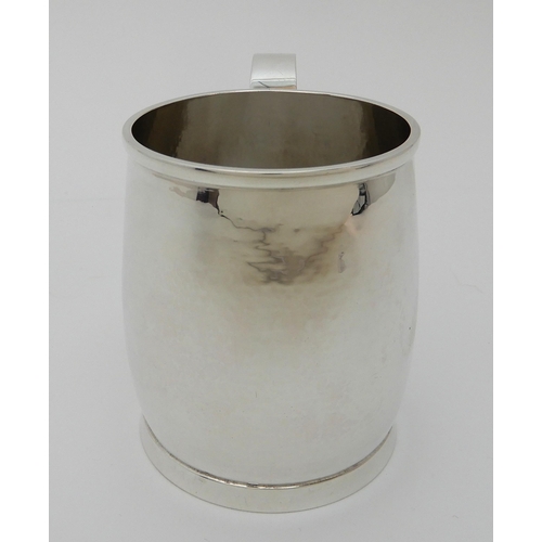 132 - A HAMMERED SILVER TANKARD