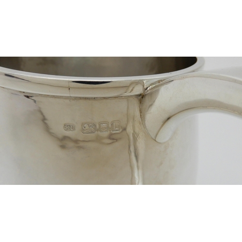 132 - A HAMMERED SILVER TANKARD