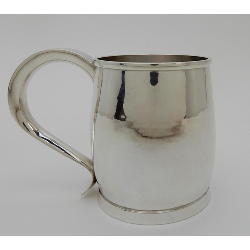 132 - A HAMMERED SILVER TANKARD