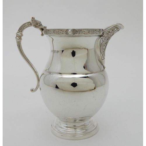 133 - A SILVER CREAM JUG