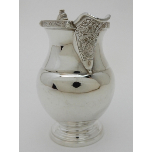 133 - A SILVER CREAM JUG