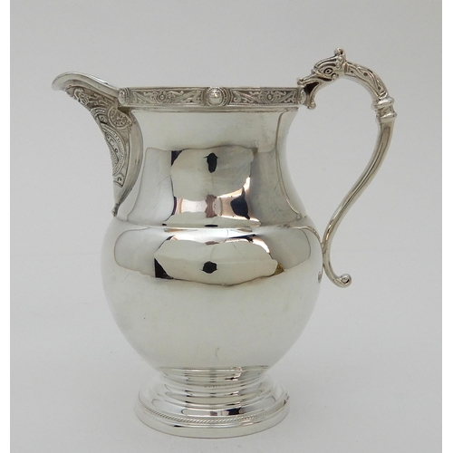 133 - A SILVER CREAM JUG