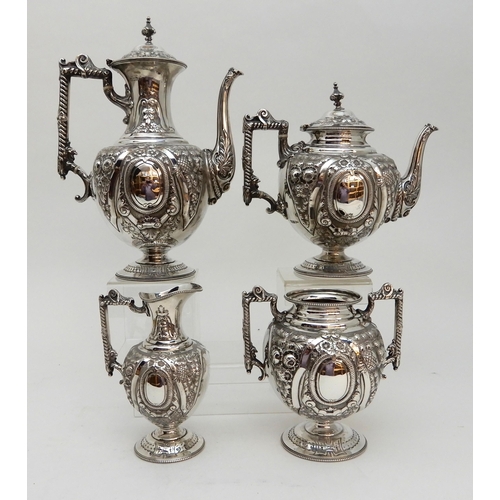 142 - AN EDWARDIAN FOUR PIECE SILVER TEA AND COFFEE SERVICE