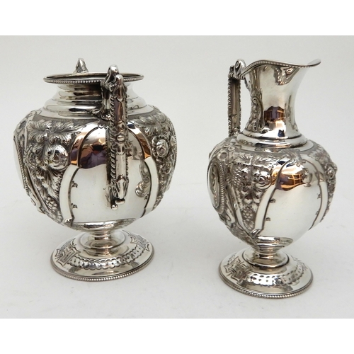 142 - AN EDWARDIAN FOUR PIECE SILVER TEA AND COFFEE SERVICE