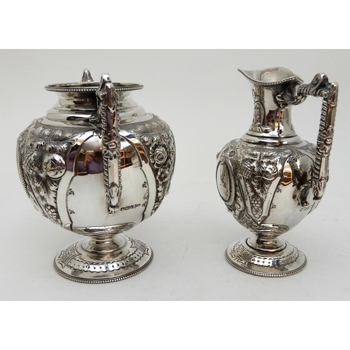 142 - AN EDWARDIAN FOUR PIECE SILVER TEA AND COFFEE SERVICE