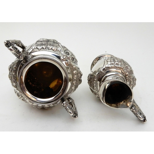 142 - AN EDWARDIAN FOUR PIECE SILVER TEA AND COFFEE SERVICE