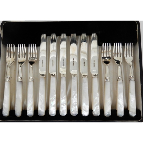 151 - A CASED 24-PIECE SILVER AND MOTHER OF PEARL DESSERT CUTLERY SET