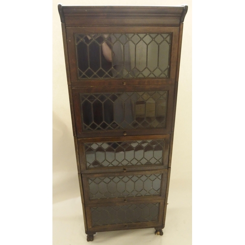 397 - A MAHOGANY LEADED GLASS SECTIONAL BOOKCASE