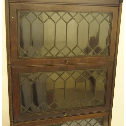 397 - A MAHOGANY LEADED GLASS SECTIONAL BOOKCASE