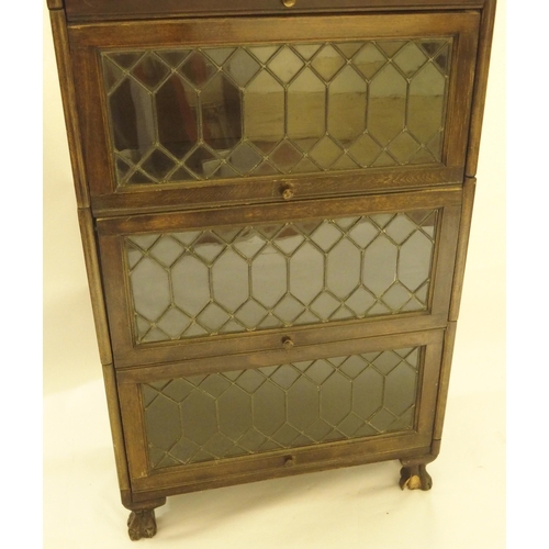 397 - A MAHOGANY LEADED GLASS SECTIONAL BOOKCASE