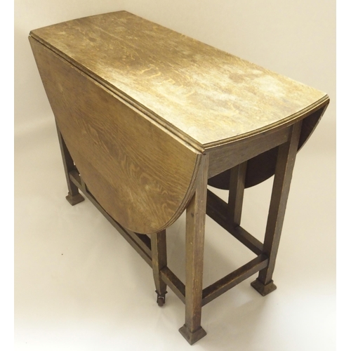 400 - AN OAK DROP LEAF TABLE