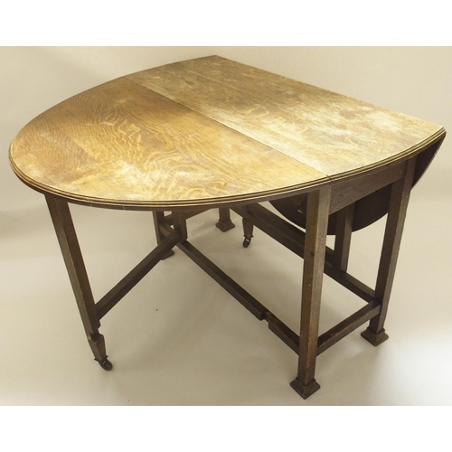 400 - AN OAK DROP LEAF TABLE