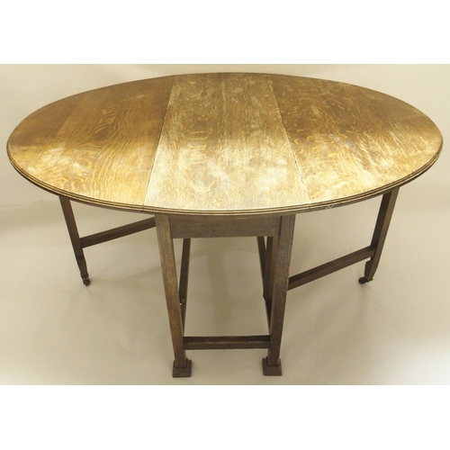 400 - AN OAK DROP LEAF TABLE