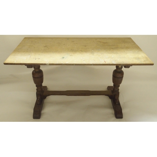 405 - AN OAK REFECTORY STYLE DINING TABLE