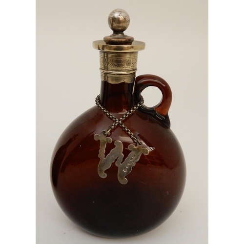 417 - A SET OF FOUR BROWN GLASS LIQUOR DECANTERS