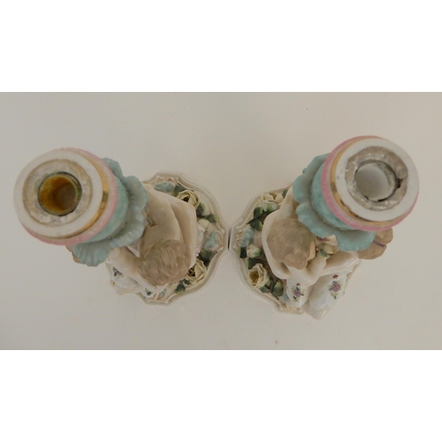 419 - A PAIR OF CONTINENTAL FIGURAL CANDELABRA