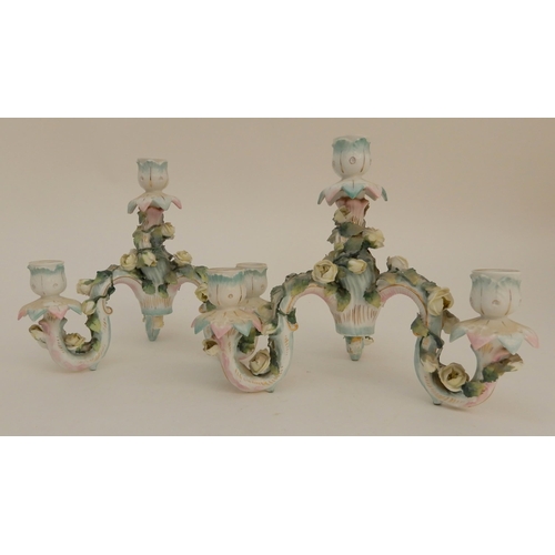 419 - A PAIR OF CONTINENTAL FIGURAL CANDELABRA