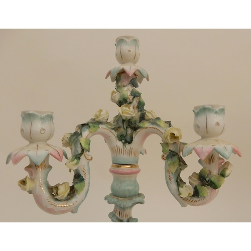 419 - A PAIR OF CONTINENTAL FIGURAL CANDELABRA