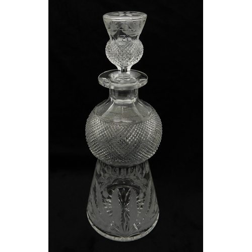 427 - AN EDINBURGH CRYSTAL THISTLE SHAPED DECANTER