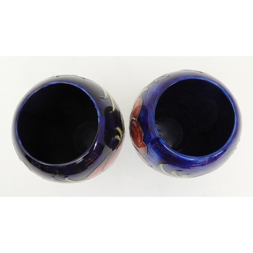 435 - TWO SIMILAR MOORCROFT ANEMONE PATTERN VASES