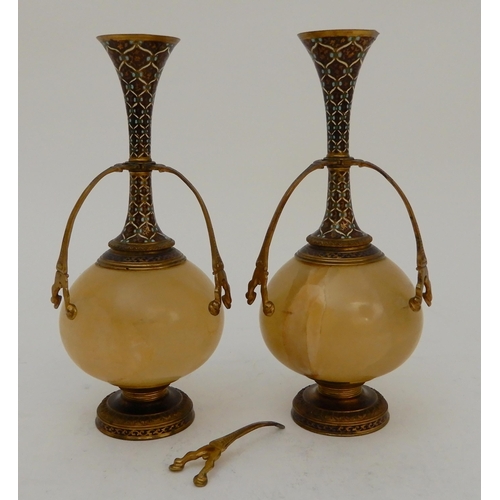 440 - A PAIR OF ONYX AND GILDED METAL VASE GARNITURES