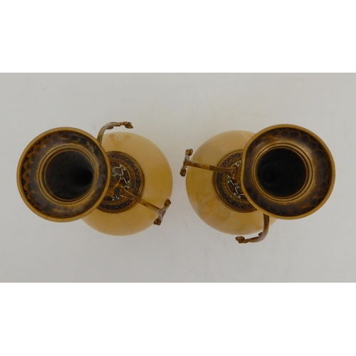 440 - A PAIR OF ONYX AND GILDED METAL VASE GARNITURES