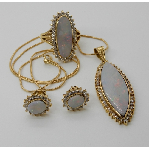 541 - A SUITE OF ARABIC GOLD  WHITE OPAL AND CLEAR GEM SET JEWELLERY