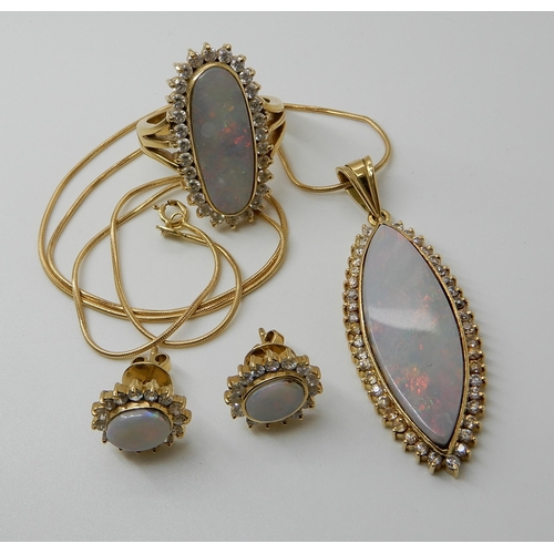 541 - A SUITE OF ARABIC GOLD  WHITE OPAL AND CLEAR GEM SET JEWELLERY