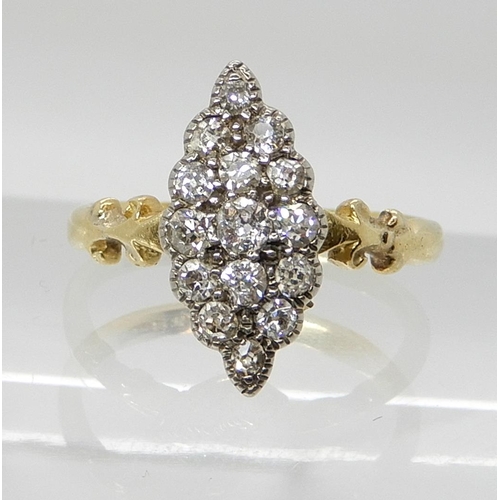 550 - AN 18CT GOLD MARQUIS DIAMOND CLUSTER RING