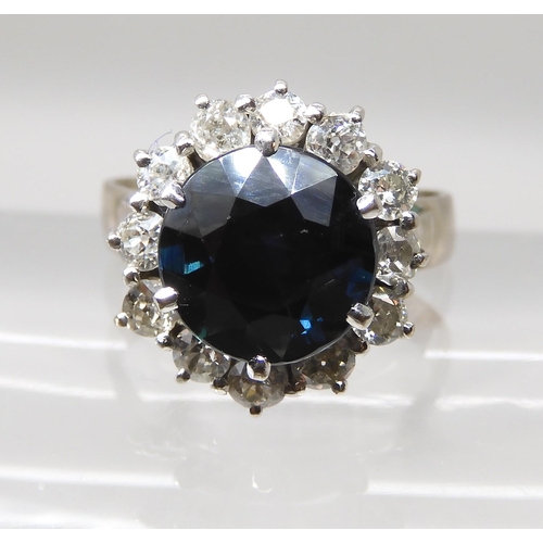 551 - A SAPPHIRE AND DIAMOND FLOWER CLUSTER RING