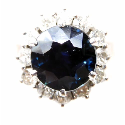 551 - A SAPPHIRE AND DIAMOND FLOWER CLUSTER RING