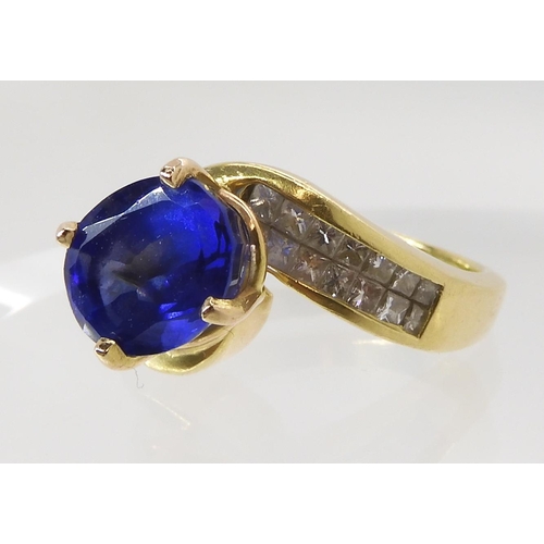 558 - AN 18CT GOLD TANZANITE AND DIAMOND DRESS RING