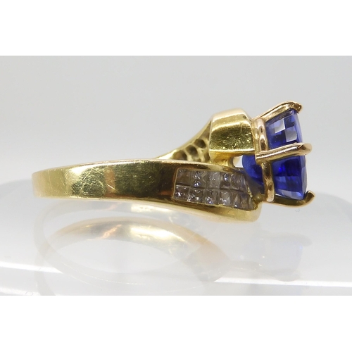 558 - AN 18CT GOLD TANZANITE AND DIAMOND DRESS RING