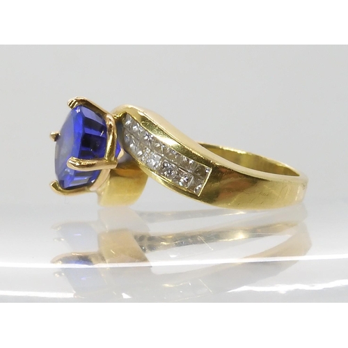 558 - AN 18CT GOLD TANZANITE AND DIAMOND DRESS RING