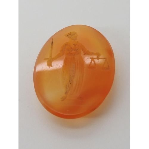 560 - A CARVED CARNELIAN INTAGLIO