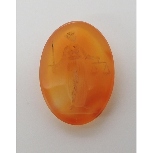 560 - A CARVED CARNELIAN INTAGLIO