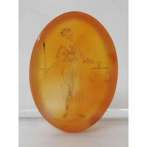 560 - A CARVED CARNELIAN INTAGLIO