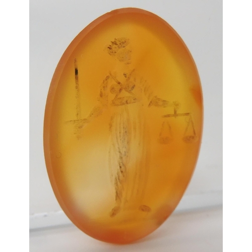 560 - A CARVED CARNELIAN INTAGLIO