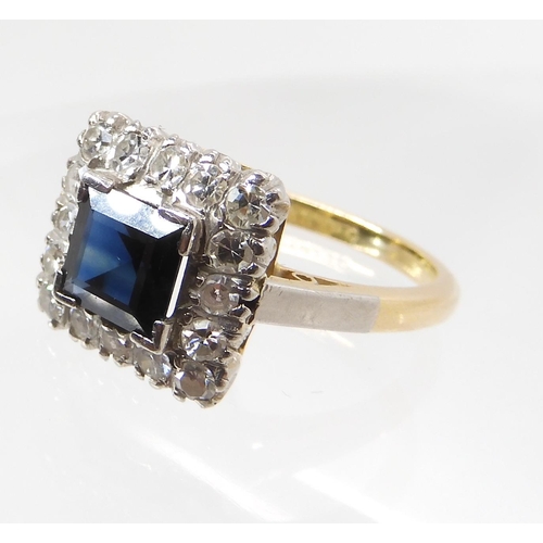 562 - AN 18CT GOLD AND PLATINUM SAPPHIRE AND DIAMOND RING