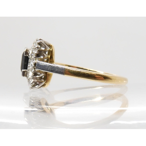 562 - AN 18CT GOLD AND PLATINUM SAPPHIRE AND DIAMOND RING