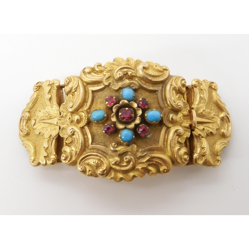 564 - A BRIGHT YELLOW METAL CLASP SET WITH TURQUOISE AND RED GEMS