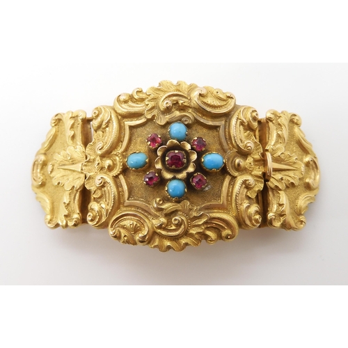 564 - A BRIGHT YELLOW METAL CLASP SET WITH TURQUOISE AND RED GEMS