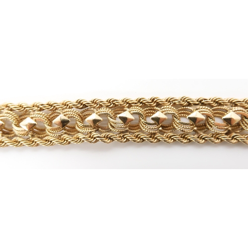 570 - A 14K GOLD FANCY LINK BRACELET