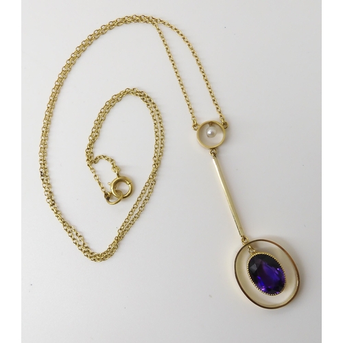 572 - A 15CT GOLD AMETHYST AND PEARL EDWARDIAN PENDANT